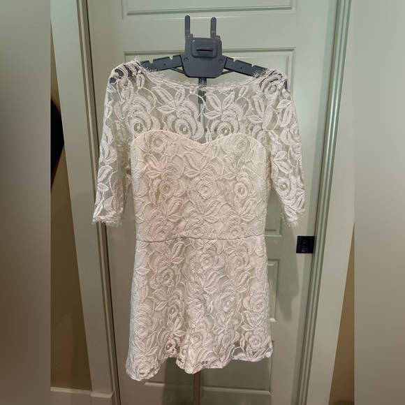 BCBG Pants - Brand new BCBG with tags beautiful lace romper. Size 6. Cream color.